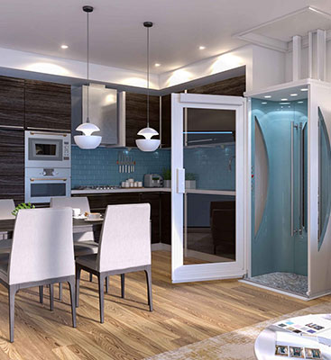 Glass residential home elevator installed beside a modern kitchen