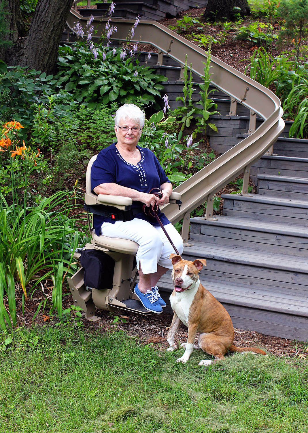 Outdoor curved stairlift installed on exterior steps, built for year-round outdoor use