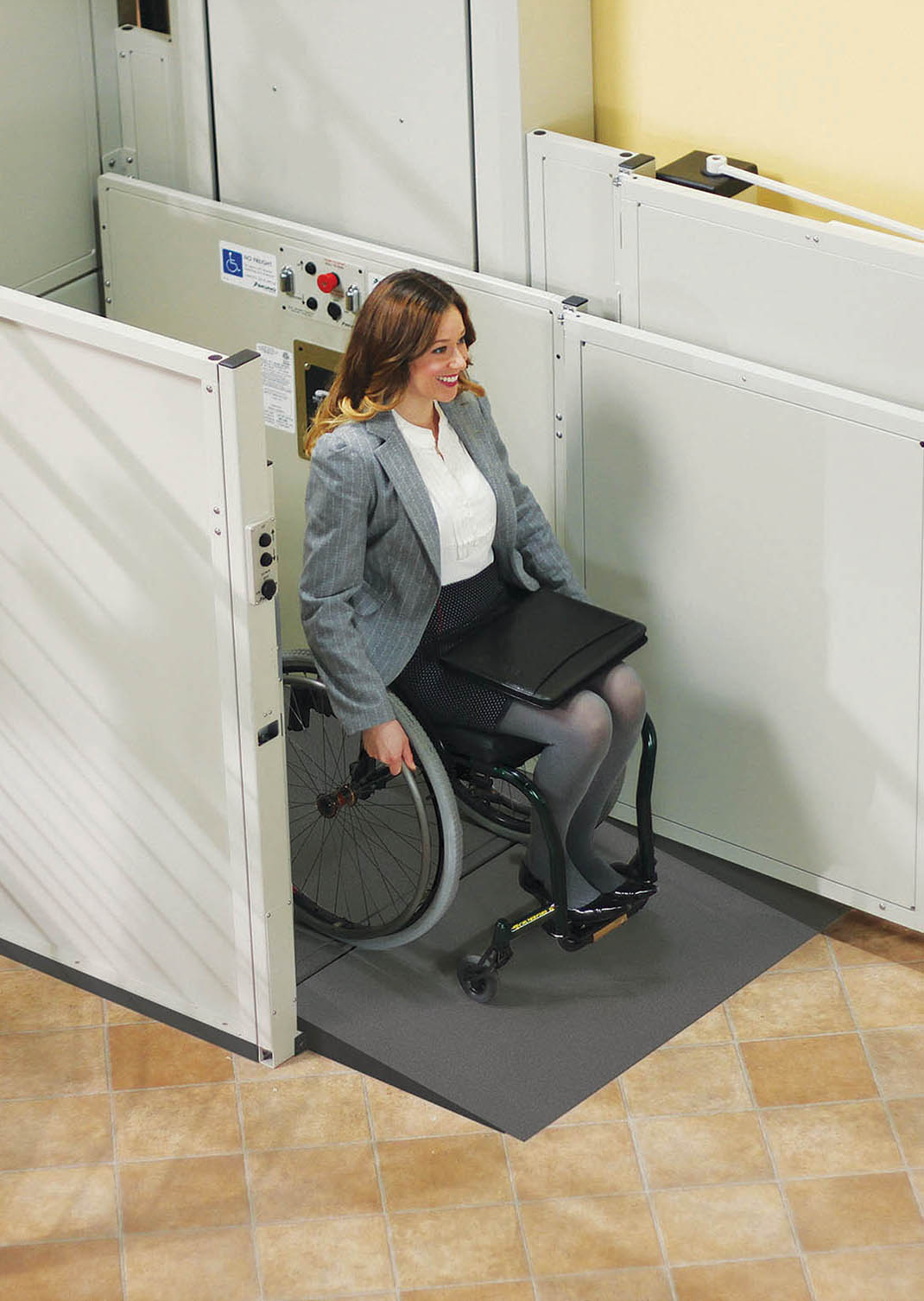 Technician installing a wheelchair platform lift