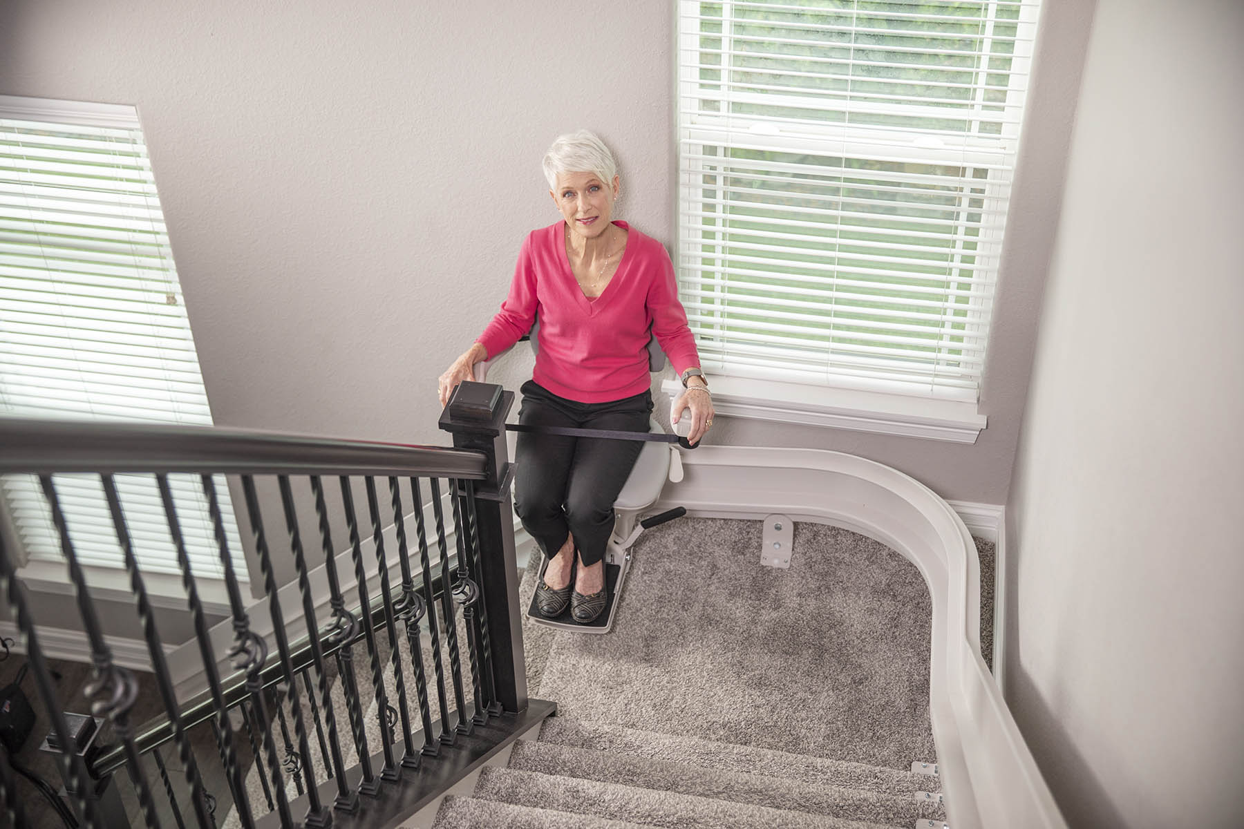 bruno-elite-curved-stair-lift-18 Bruno Elite curved rail stair lift following the turn of a residential staircase