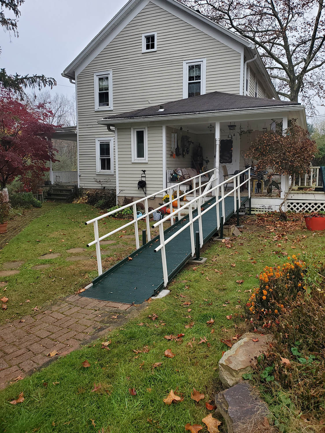 residential-ramp-installation-nj Modular aluminium wheelchair ramp installed at the front door of a New Jersey home